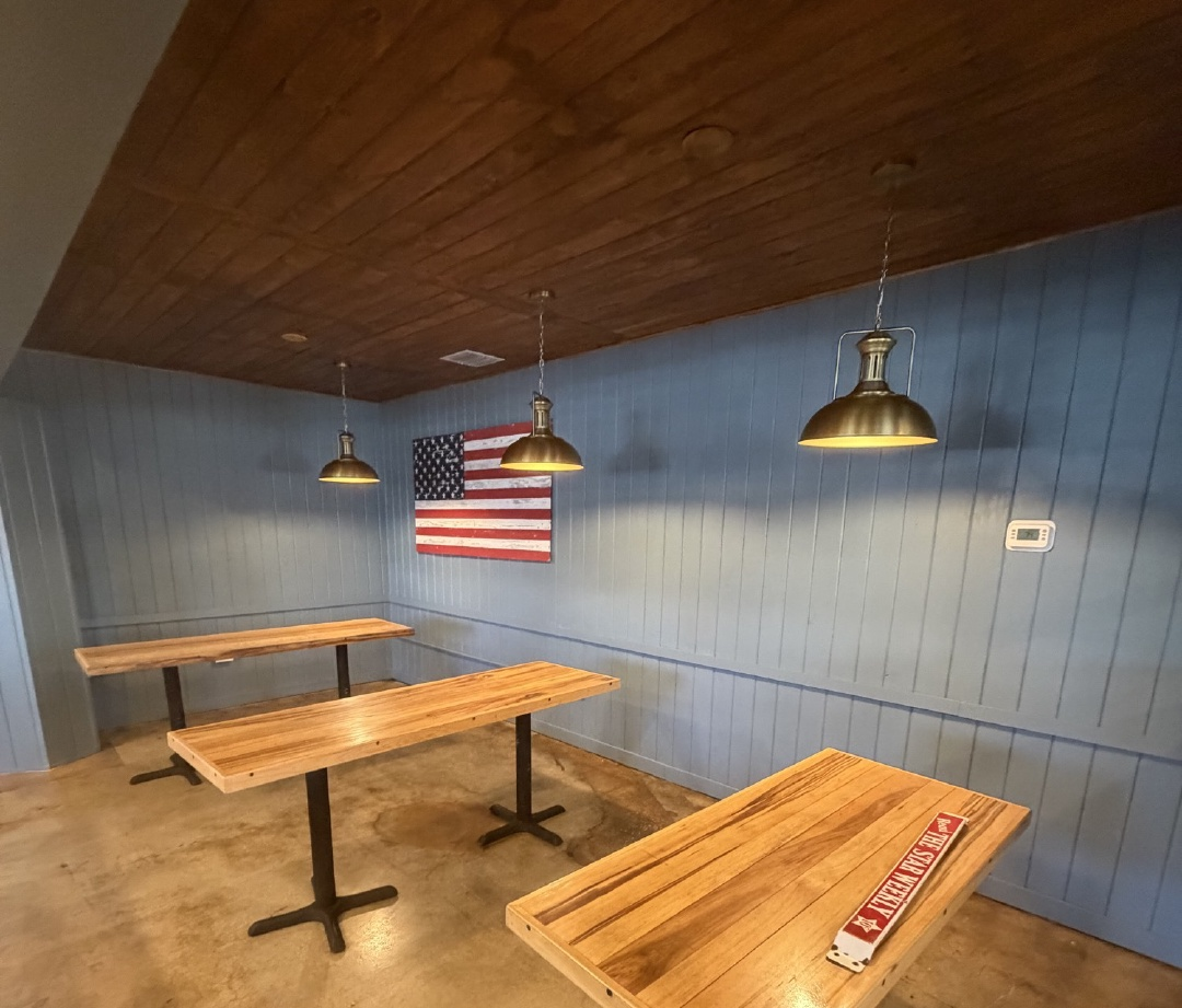 Renovated hospitality interior with wood ceiling and custom finishes